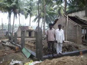 Two Men Standing By New Construction
