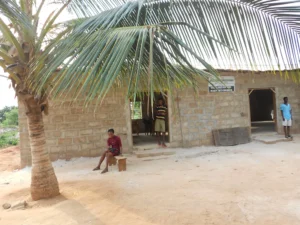 Person Sitting In Front Of A New Building