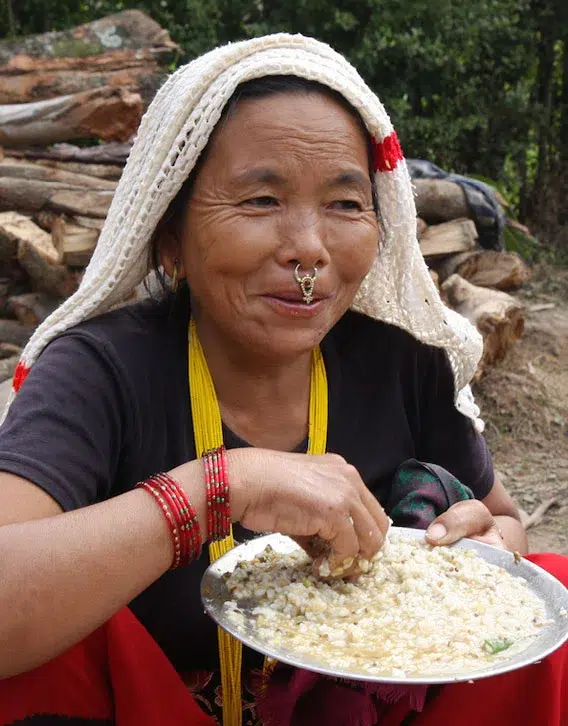 Woman Eating A Meal From A Plate